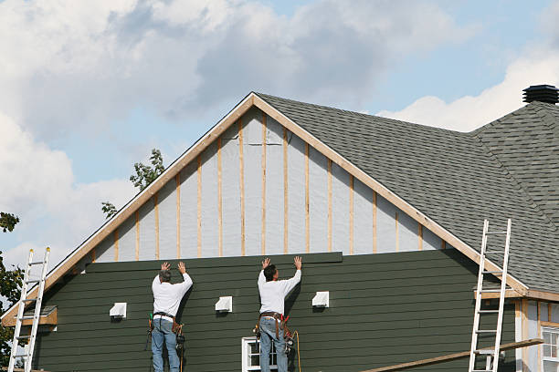 Professional Storm Damage Siding Repair technician working in Goshen, OH